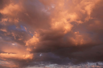 Epic dramatic sunset, sunrise storm sky with dark orange yellow clouds and sunlight, heaven