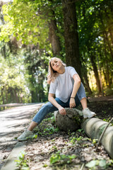 Woman walking at forest and breathing fresh air enjoy free time