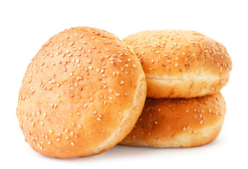 Three burger buns on a white background. Isolated