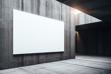 Modern gallery room with empty billboard on wall.