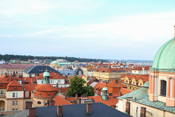 Fototapeta na wymiar European city summer landscape, evening view of red tiled roofs