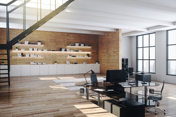 Loft office desk with personal computer and supplies.