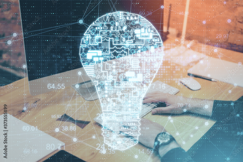 Poster Businessman hand using computer with glowing circuit light bulb