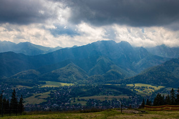 landscape of the Tatra Mountains and Giewont Gubałówka on a warm summer cloudy holiday day