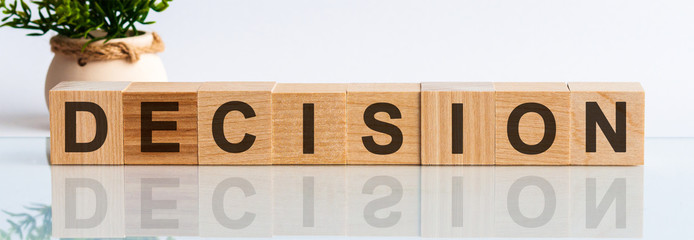 Decision word written on wood block. Decision text on wooden table for your desing, Top view...