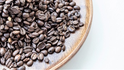 coffee beans in a wooden plate
