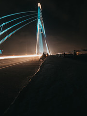 Fototapeta na wymiar Delhi, India-August 24 2020 : Signature Bridge is a cantilever spar cable-stayed bridge which spans the Yamuna river at Wazirabad section, connecting Wazirabad to East Delhi.
