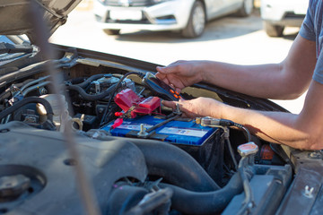 Checking the battery charge with a tester. Battery repair and replacement.