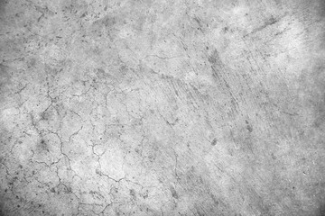 Grey rough textured cracked concrete cement stone wall texture background
