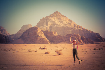 Fototapeta na wymiar woman jumping on the desert