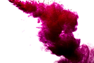 A cloud of red paint is released into the clear water. Isolate on a white background.
