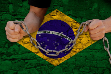 male hands break the iron chain, a symbol of bondage,protest against the background of the national...