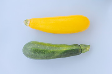 Fresh vegetable marrow isolated on blue background