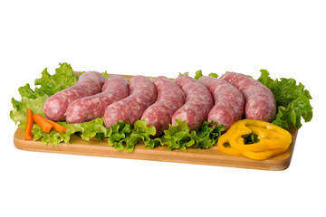 raw pork sausage on cutting board