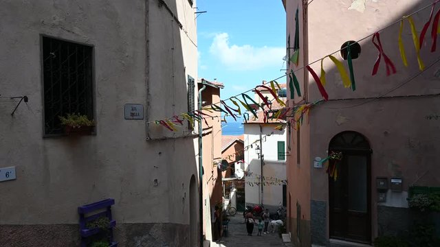 walk enjoying the beauties among the narrow streets of a medieval village in TOscana central Italy near the harbor, Porto Santo Stefano 4K 12 bit UHD