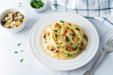 Mussel pasta with pepper and parsley in a plate