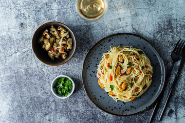 Mussel pasta with pepper and parsley in a plate