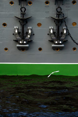 Old sea anchor on Board a large cruiser with illuminator flying Seagull