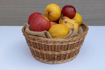 basket with apples pears and lemons selective focus food sweet