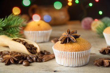 Delicious homemade Christmas pastries on a wooden table. Spruce branches and star anise. Selective focus.