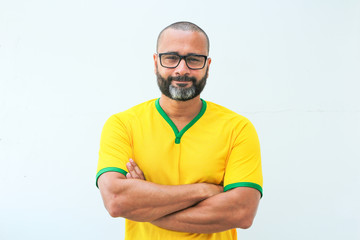 Brazilian soccer fan celebrating on white background