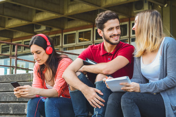 University students taking a break and relaxing outdoors.