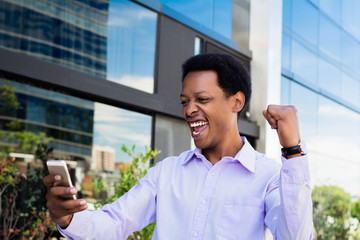 Afro american businessman celebration victory.