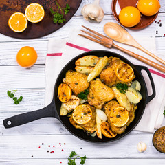Chicken Thighs Roasted with Meyer Lemon and Potatoes. Selective focus.