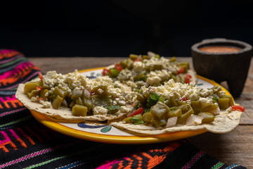 Mexican nopal cactus tacos with cheese on wooden background
