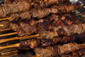 Beef barbecue on bamboo skewers. Roast beef skewer.