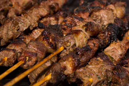 Close up photograph of beef skewers made on the grill. Photo of meat barbecue. Fast food.