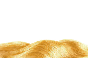 Fototapeta premium Blond shiny hair isolated on white. Background with copy space