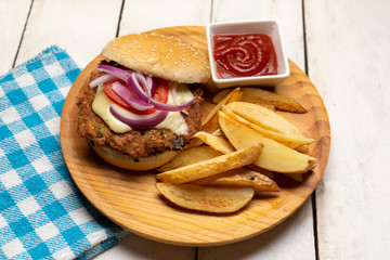 Tuna burger with potato fries on white background