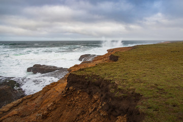 Waves breaking on California coastline 