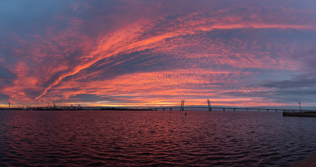 Fototapeta na wymiar Panorama of the bridge over the bay during sunset