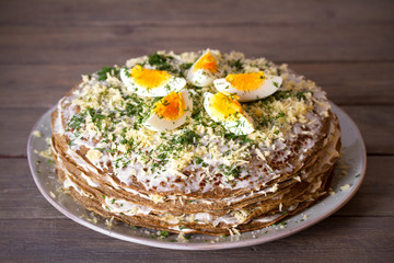Layered liver cake with cheese, mayonnaise and dill. Savory cake. horizontal photo