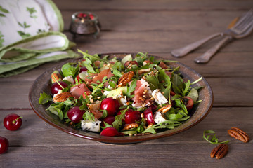 Strawberry and prosciutto salad with gorgonzola cheese and arugula. Healthy food. horizontal photo