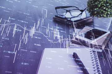 Double exposure of forex chart drawing and cell phone background. Concept of financial trading