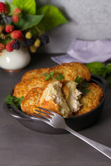 Potato Cakes with beef meat filling. Vegetable fritters, latkes, draniki. Vegetable pancakes