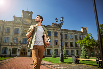 Male student looking up at the sky
