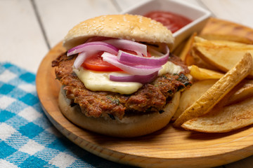 Tuna burger with potato fries on white background
