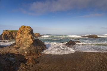 Waves breaking on rocks on the beach