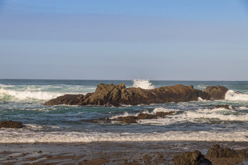 Waves breaking on rocks in ocean
