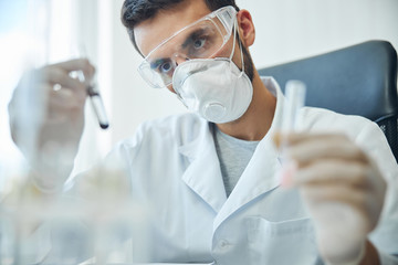 Biochemist examining biological substances in a laboratory
