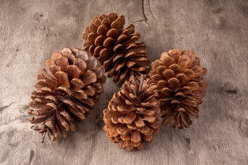 Group of pinecones over wooden table