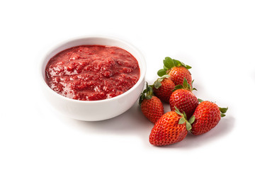 Strawberry jam and straberries isolated over white background