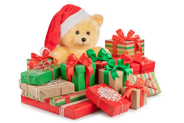 Teddy bear and boxes with gifts isolated on white