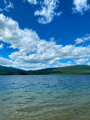 blue sky and clouds, over lake