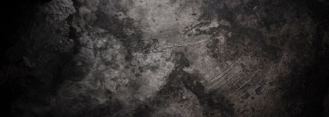 Panoramic background - old dark concrete wall with cracks