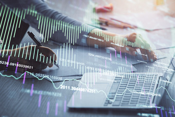 Double exposure of businesswoman hands typing on computer and forex chart hologram drawing. Financial analysis concept.